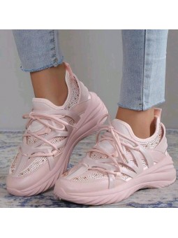 Różowe buty sportowe na...